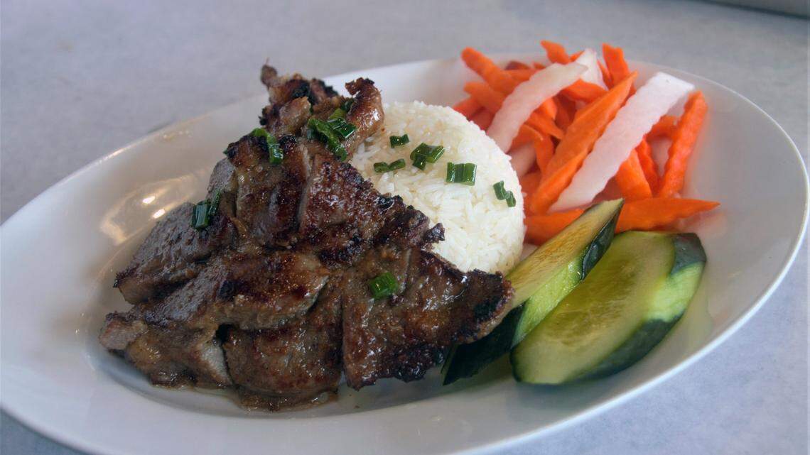 Pork chop with steamed white rice at Noah’s Seafood & Noodles in Ocean Springs.