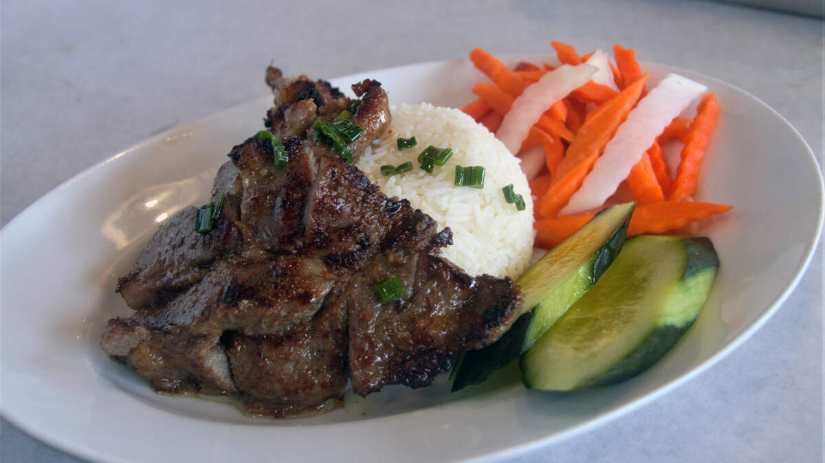 Pork chop with steamed white rice at Noah’s Seafood & Noodles in Ocean Springs.