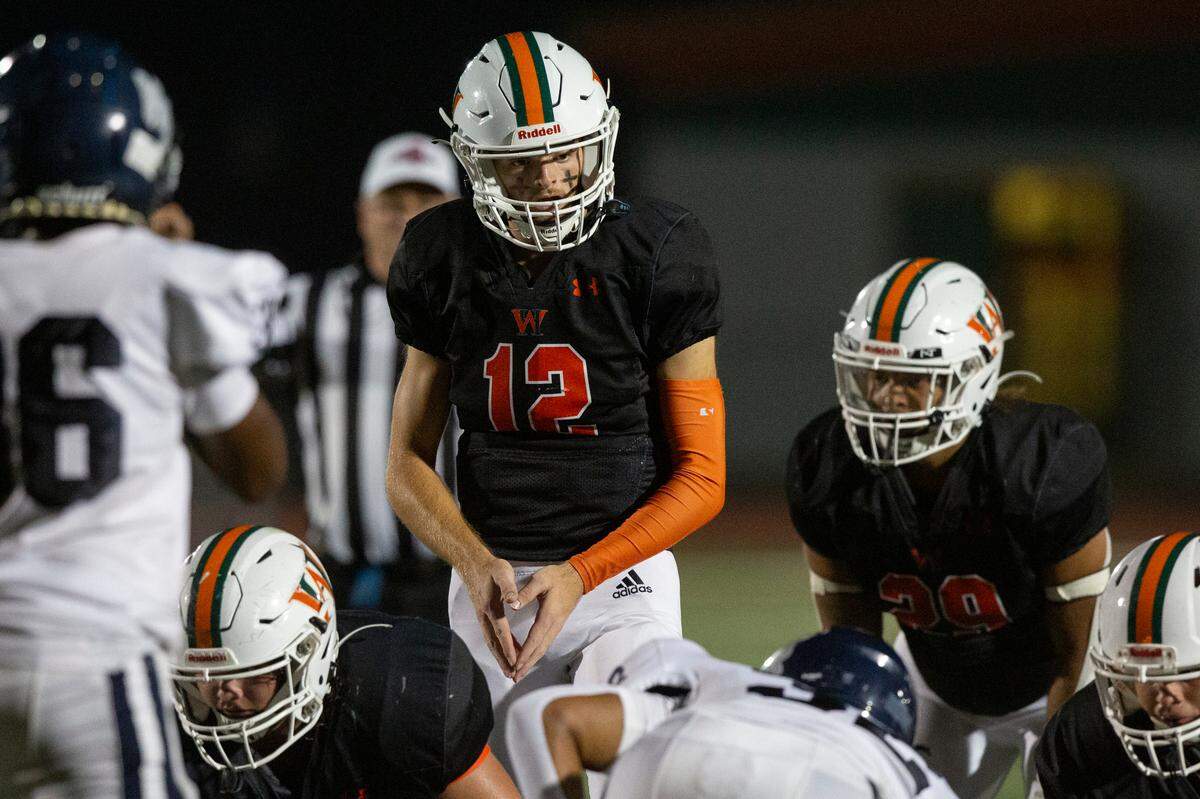 West Harrison Hurricanes’ quarterback Brady Martin prepares for the snap during a game against Moss Point at West Harrison High School in Gulfport on Friday, Sept. 22, 2023.