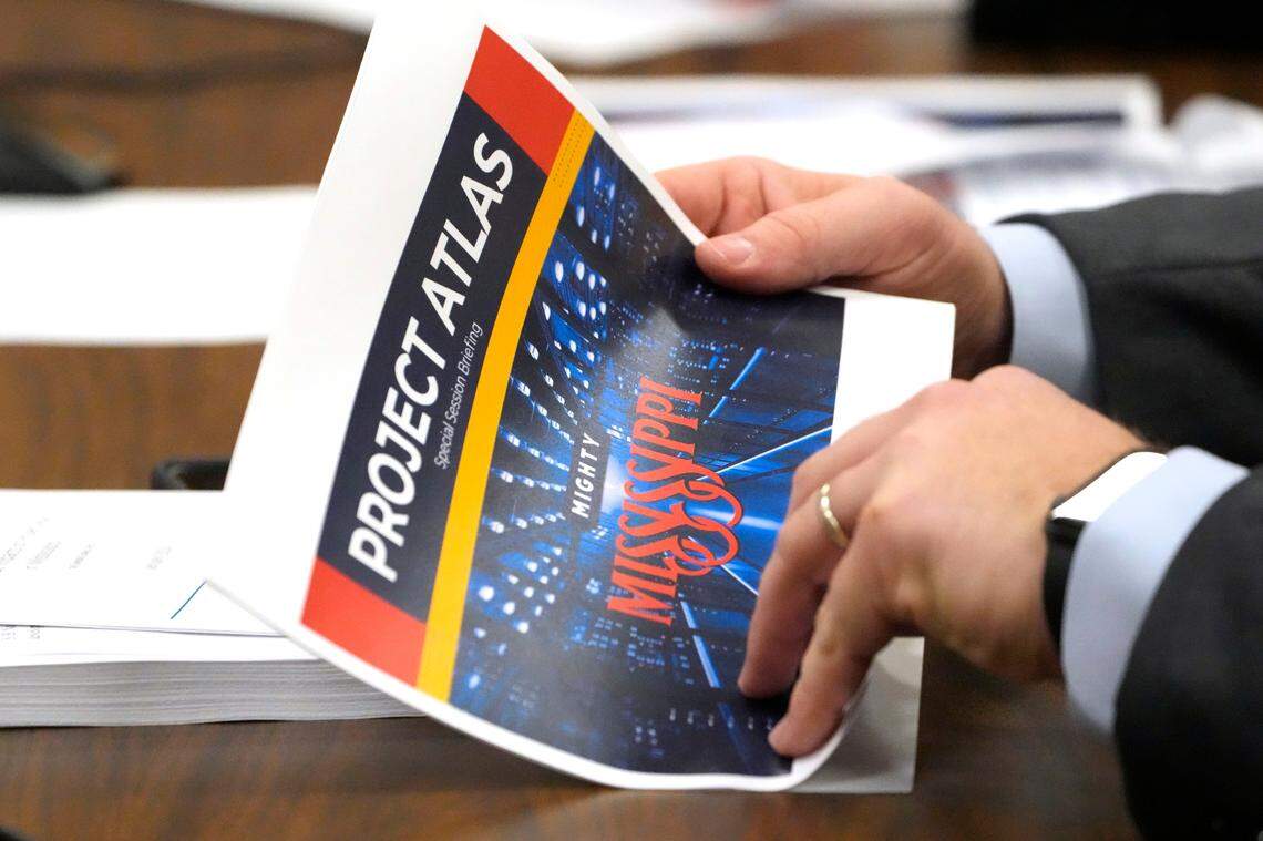 A member of the Mississippi Senate Finance Committee examines an outline for Project Atlas.