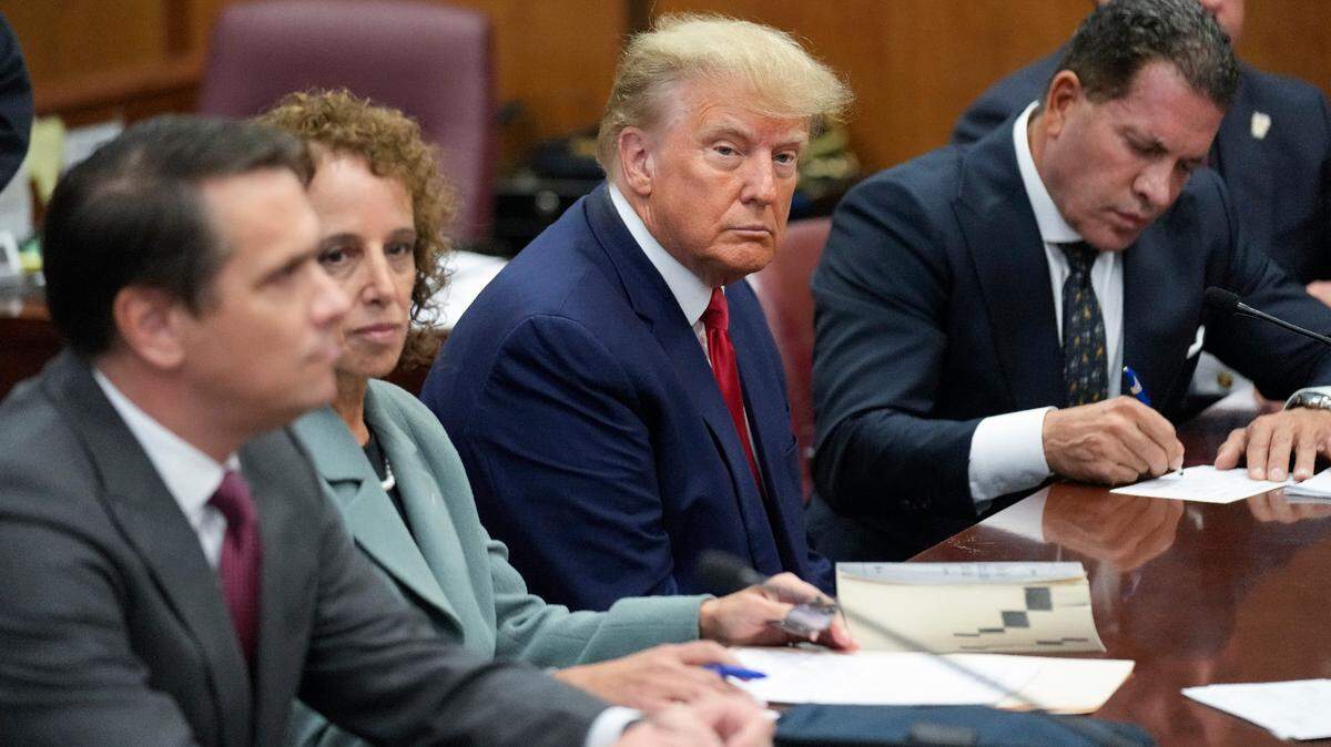 Former President Donald Trump sits at the defense table with his legal team in a Manhattan court, Tuesday, April 4, 2023, in New York. Trump is appearing in court on charges related to falsifying business records in a hush money investigation, the first president ever to be charged with a crime. (AP Photo/Seth Wenig, Pool)