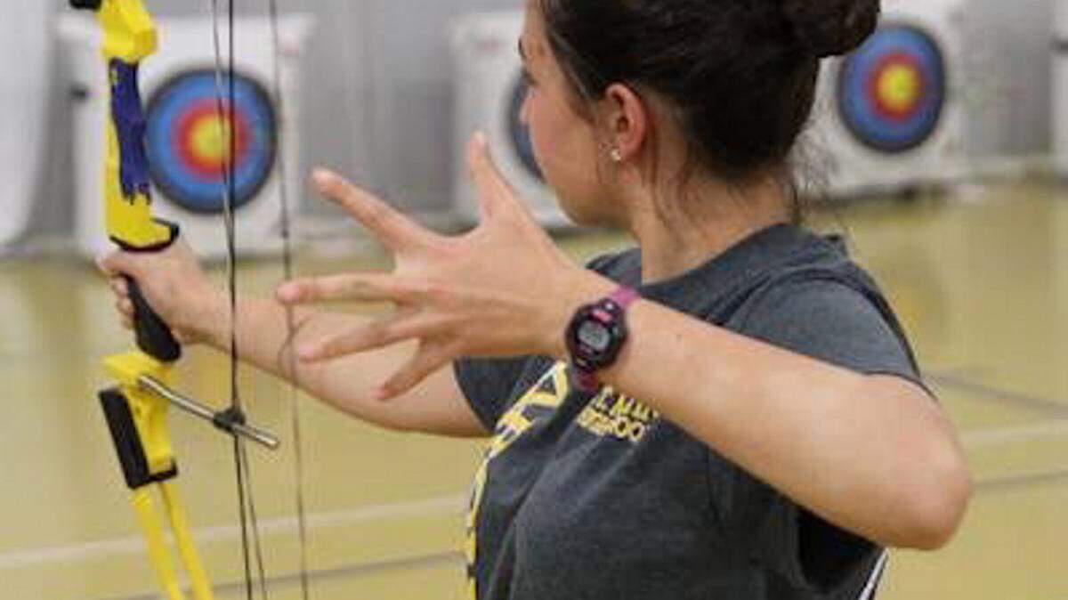 ST. MARTIN HIGH SCHOOL 
 St. Martin's Juliana Heise shoots at a recent Archery practice.