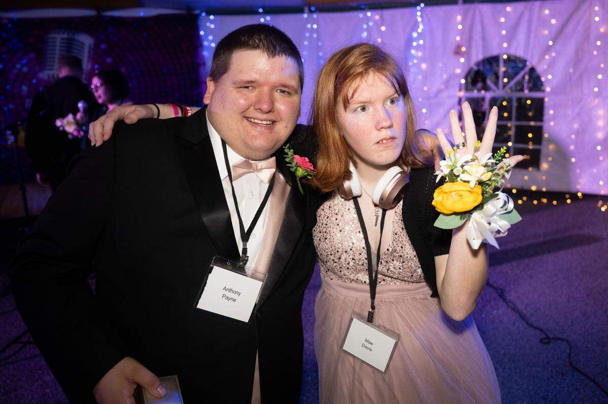 Mae Davis, right, shows off her ring given to her by Anthony Payne, left, during Night to Shine at Woolmarket Baptist Church on Friday, Feb. 13, 2026.