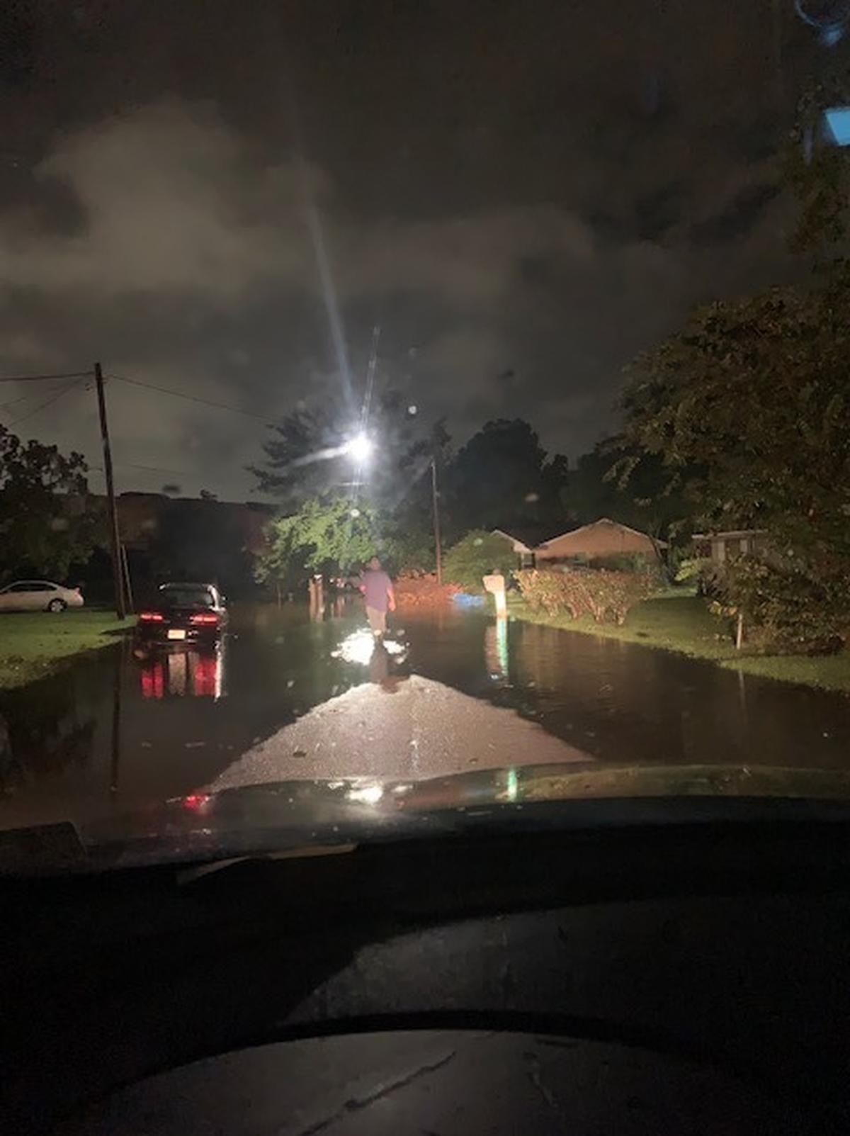 A Forest Heights resident tries to get to his car in the early morning hours of Tuesday, Aug. 31, 2021, as floodwaters brought by Hurricane Ida filled the historic subdivision.