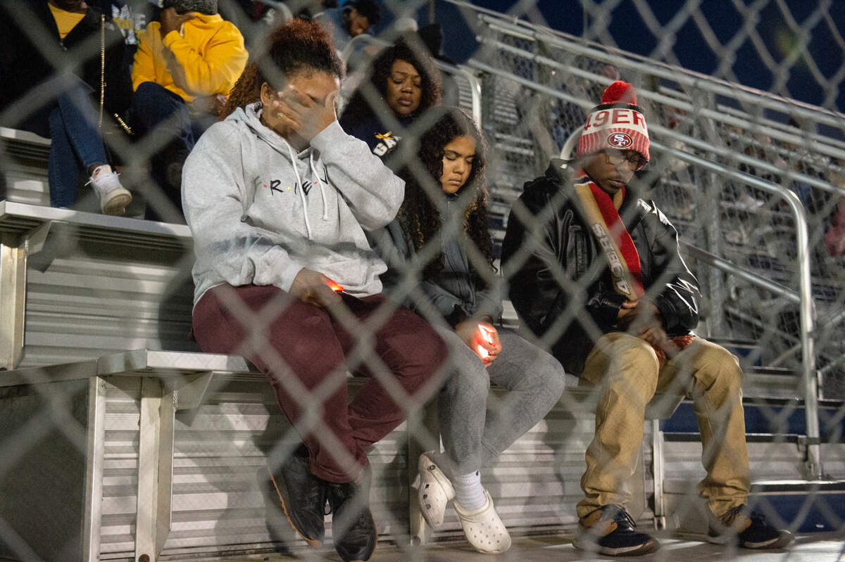 Family, friends and community members listen to prayers during a candlelight vigil in honor of three Gautier High School graduates at Gautier High School in Gautier on Thursday, Dec. 7, 2023. Se’Dhari Saniya Watson-Person, Kyla “Muffin” Watkins, and Tatyanna Richmond were involved in a fatal crash on Tuesday, leading to the deaths of Watson-Person and Watkins.