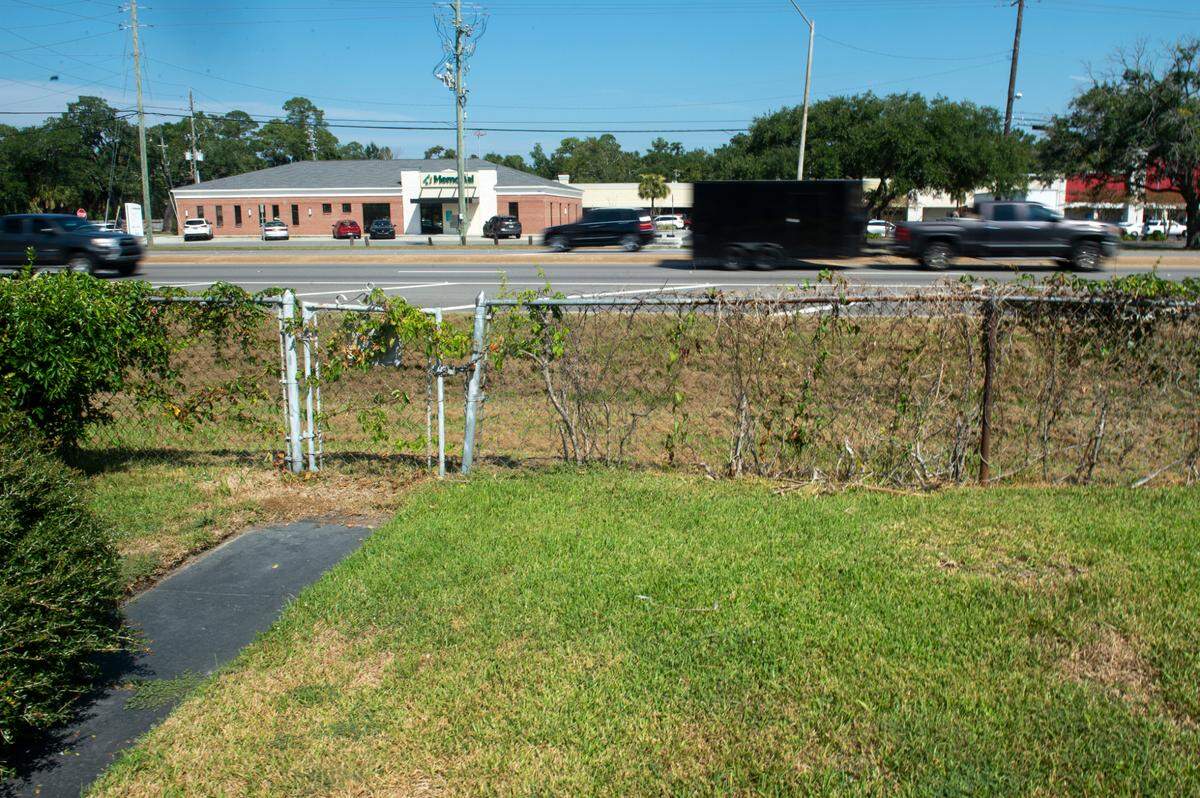 The back of Mary Gipson’s house faces busy U.S. 90, also known as Bienville Boulevard, in Ocean Springs on Tuesday, Sept. 26, 2023.