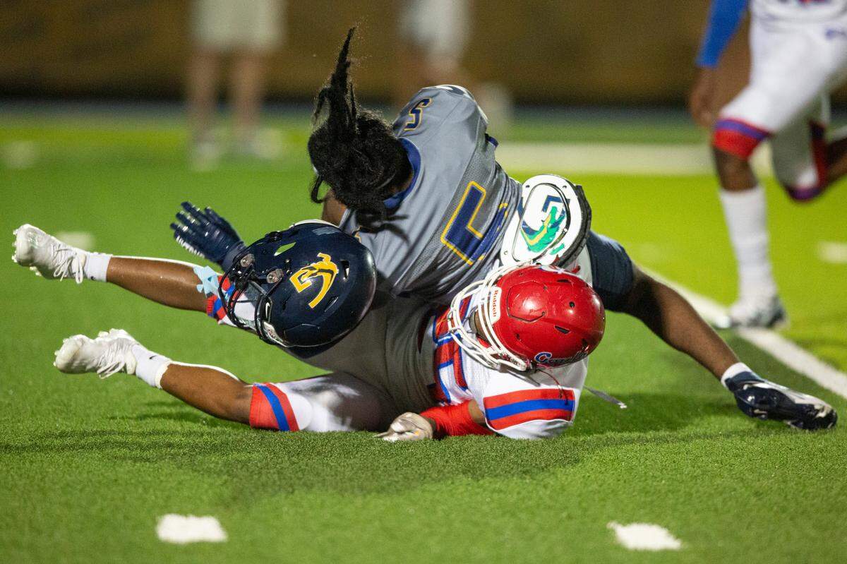 Gautier’s Emmitt High gets his helmet knocked off during a game against Pascagoula at Gautier High School in Gautier on Friday, Sept. 2, 2022.