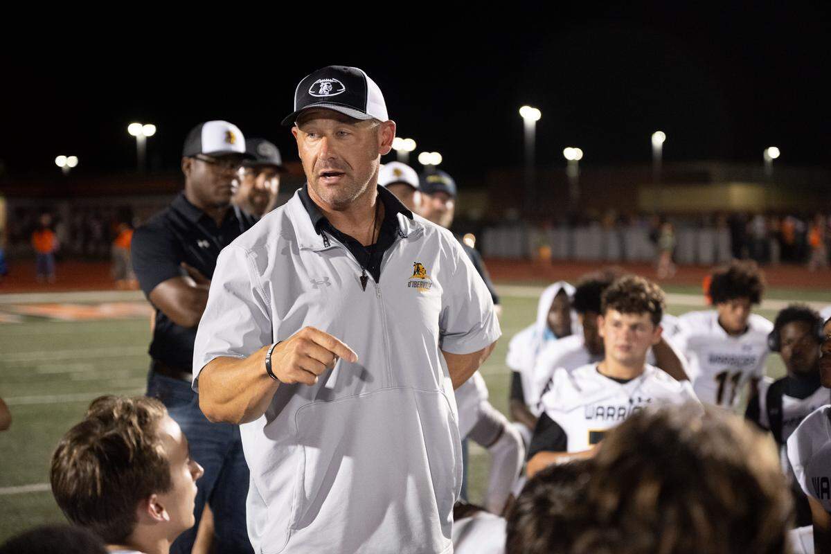 D’Iberville head coach Josh Ladner addresses his team after a win over West Harrison that moved the Warriors atop Region 4-7A.