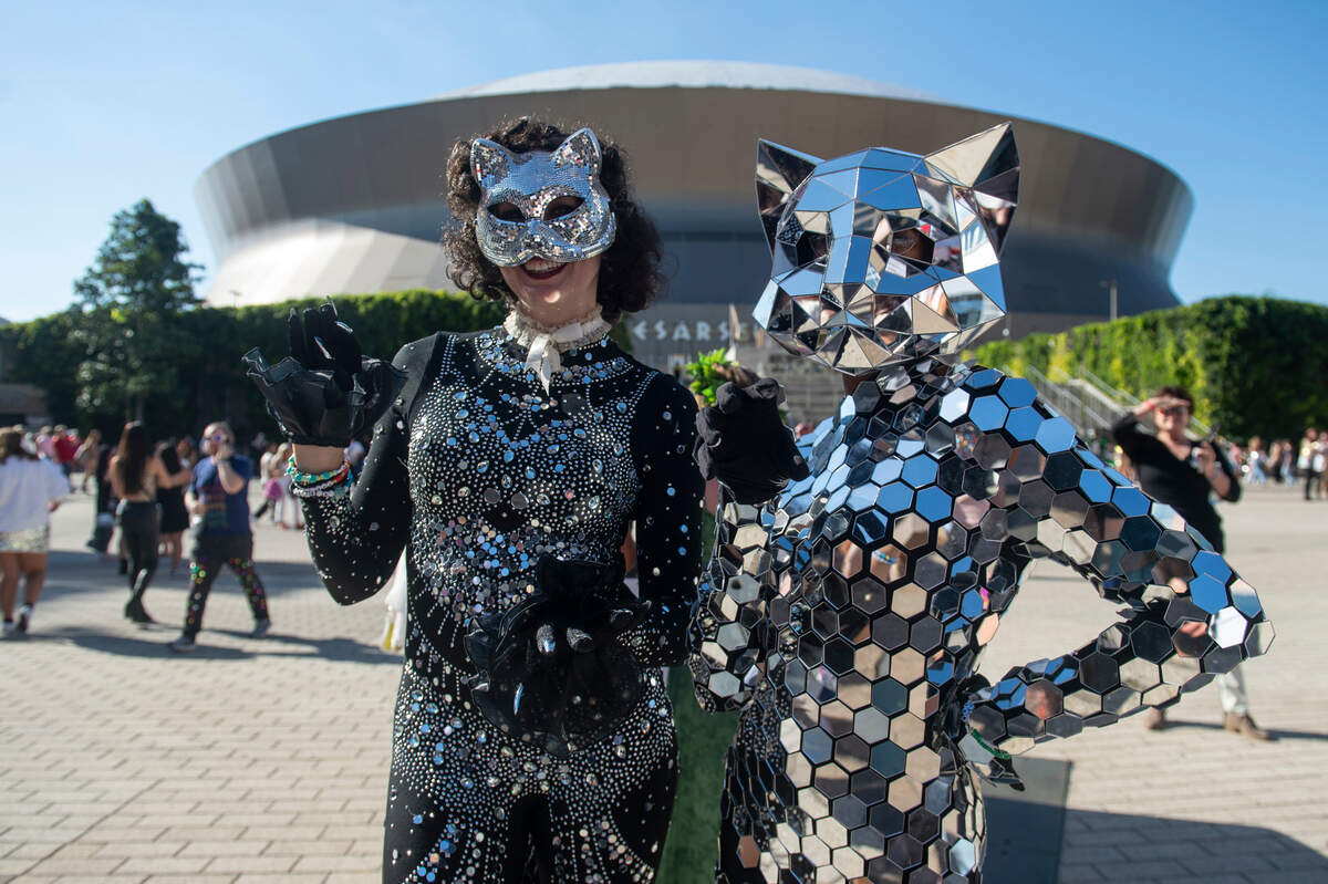Performers show off their outfits outside the Cesars Superdome in New Orleans on Friday, Oct. 25, 2024, before Taylor Swift’s Eras Tour performance that night.