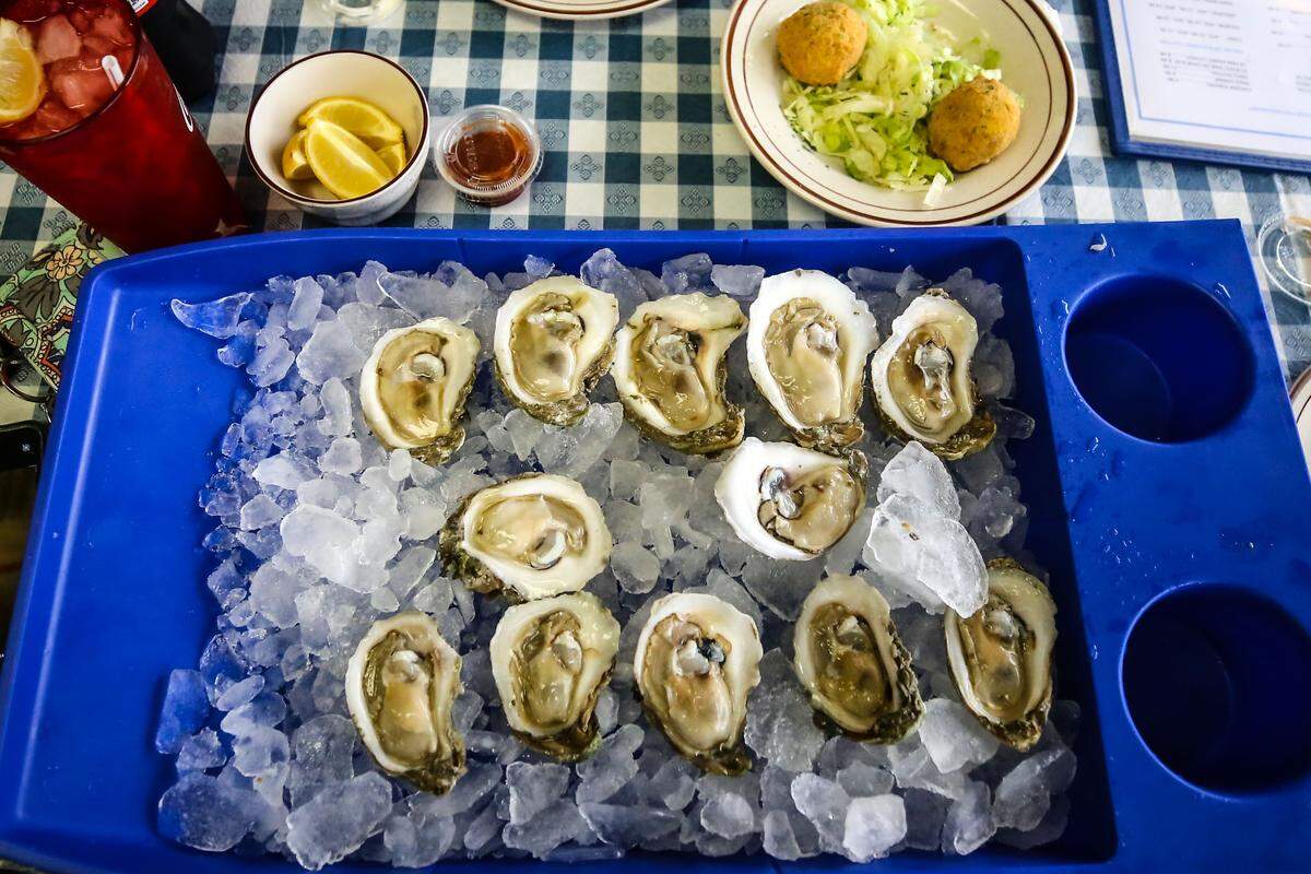 MacBe Seafood and Cafe’s raw oysters come in a bright blue, over-sized tray filled with ice and shucked oysters. With the shortage of oysters in Mississippi, MacBe’s currently gets their oysters from Texas and Louisiana.