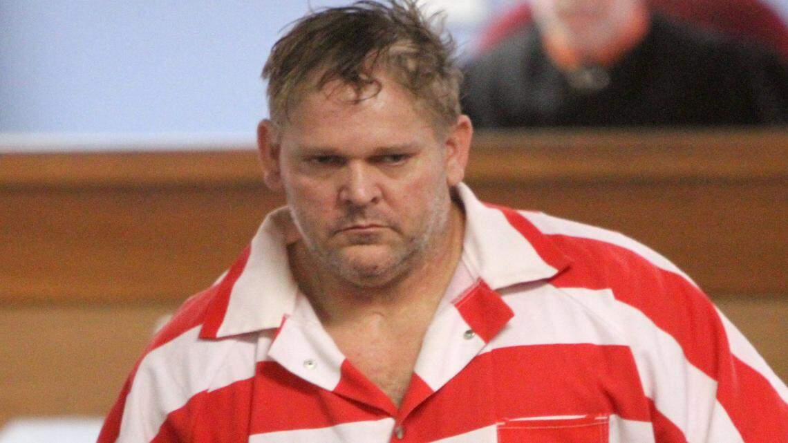 Johnny Max Mount returns to his seat after his initial appearance in Harrison County court on a charge of first-degree murder in the Friday shooting of Waffle House server Julie Brightwell.