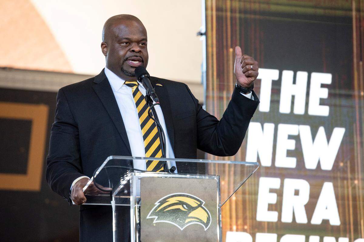 Southern Miss’ new head football coach Charles Huff makes an introductory speech during a public welcome celebration for Huff at The Rock in Hattiesburg on Thursday, Dec. 12, 2024.