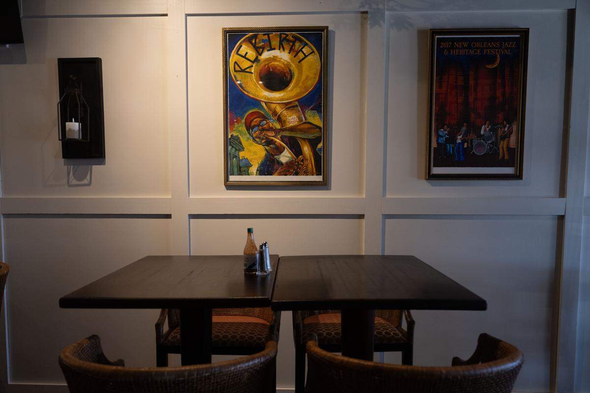 Various pieces of art hang over the tables at Marcello’s Taste of New Orleans on Thursday, Dec. 11, 2025.
