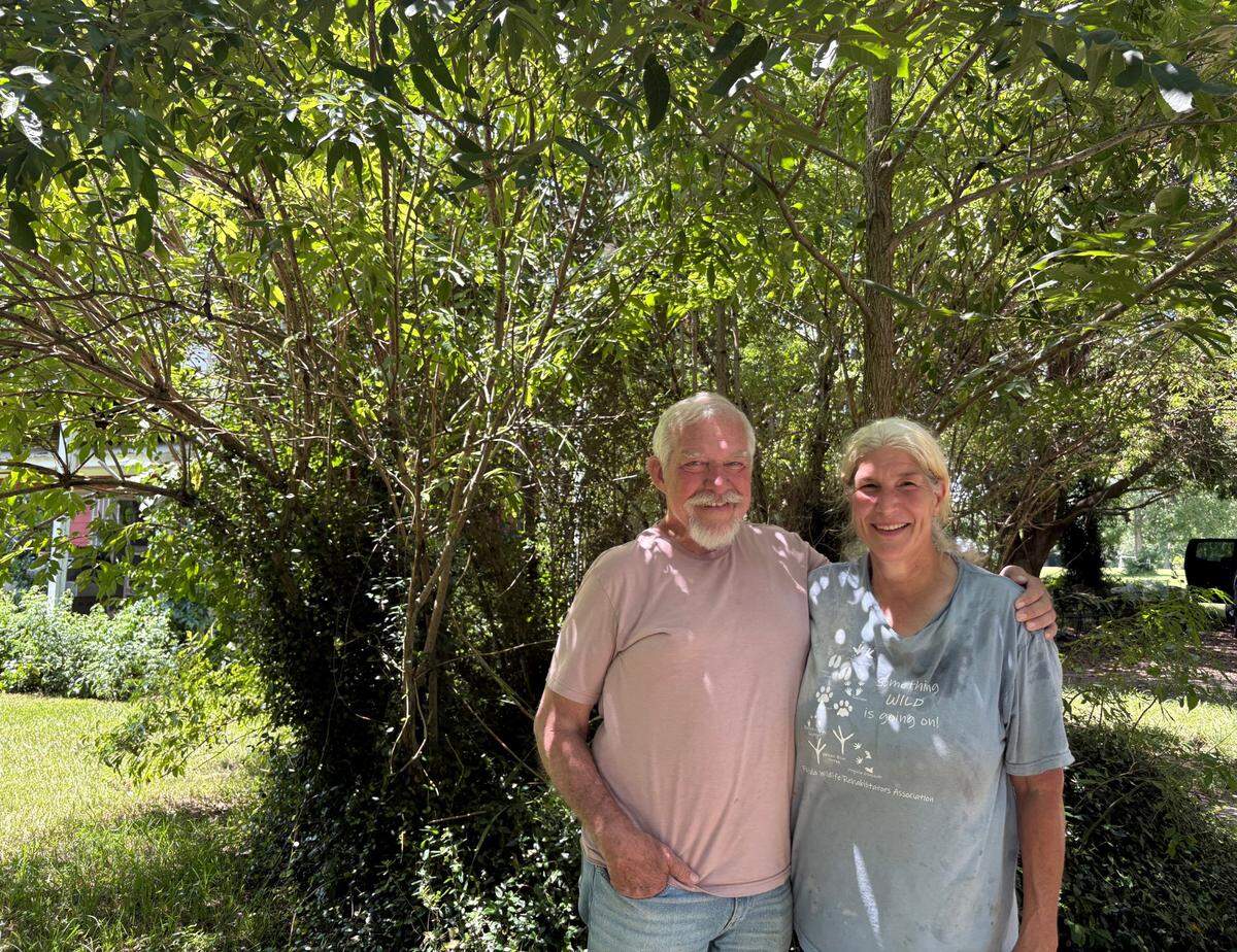 Jerry Gathof is pictured with his wife, Paula Woodside, who runs Woodside Wildlife Rescue on their property in Harrison County.