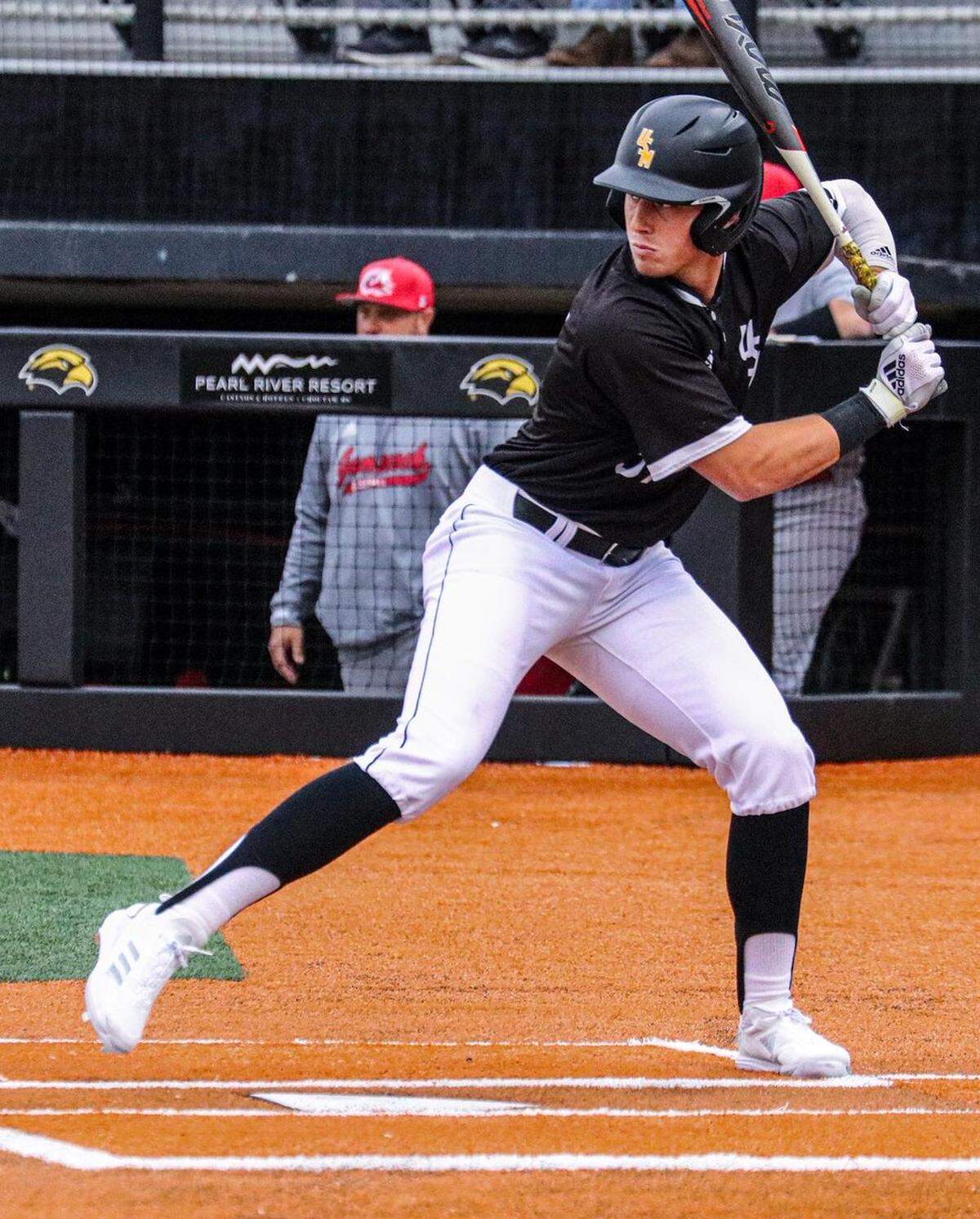 Southern Miss outfielder Carson Paetow steps into a swing against Jacksonville State.