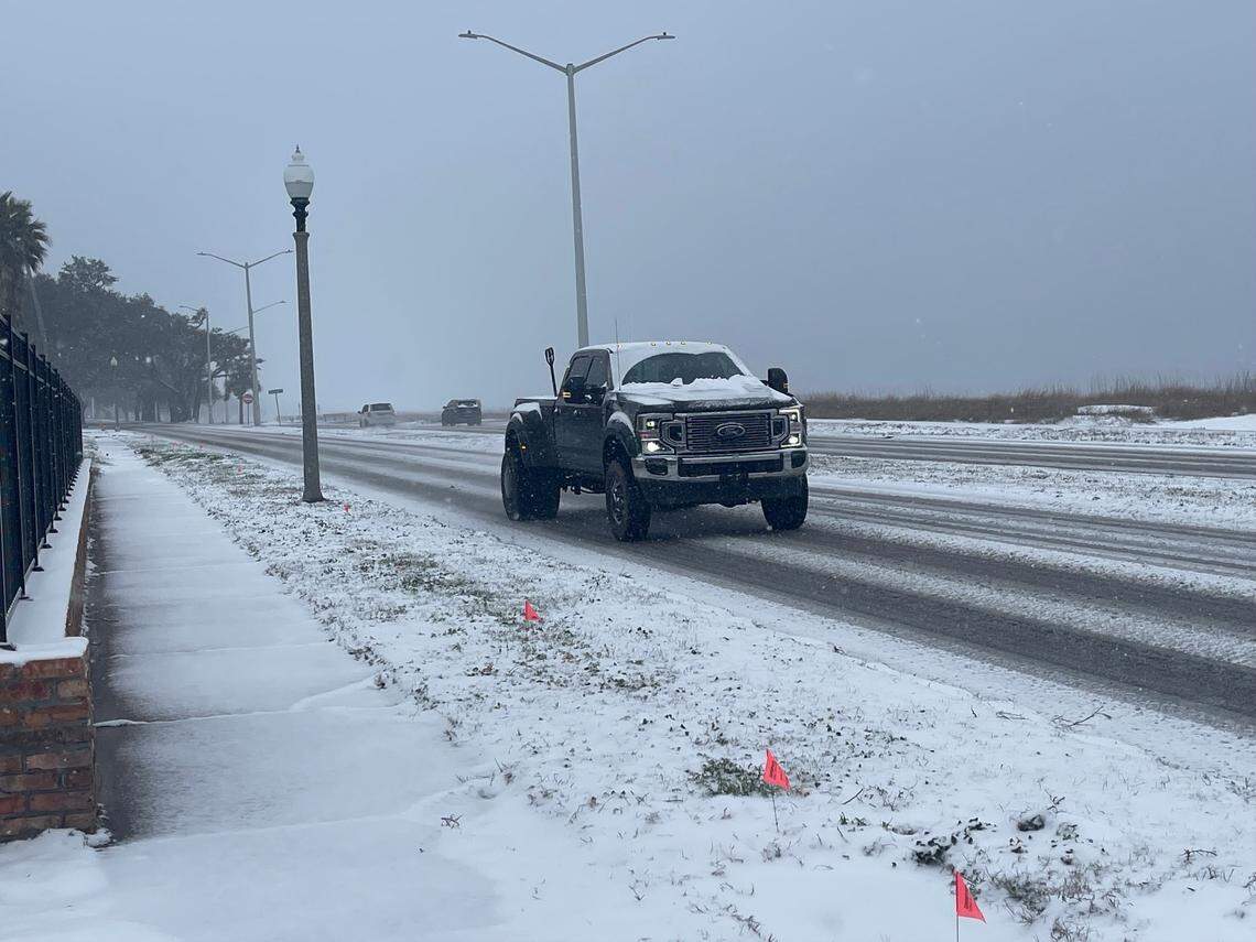 Drivers on U.S. 90 in Biloxi are braving the elements Tuesday as snow falls across South Mississippi.