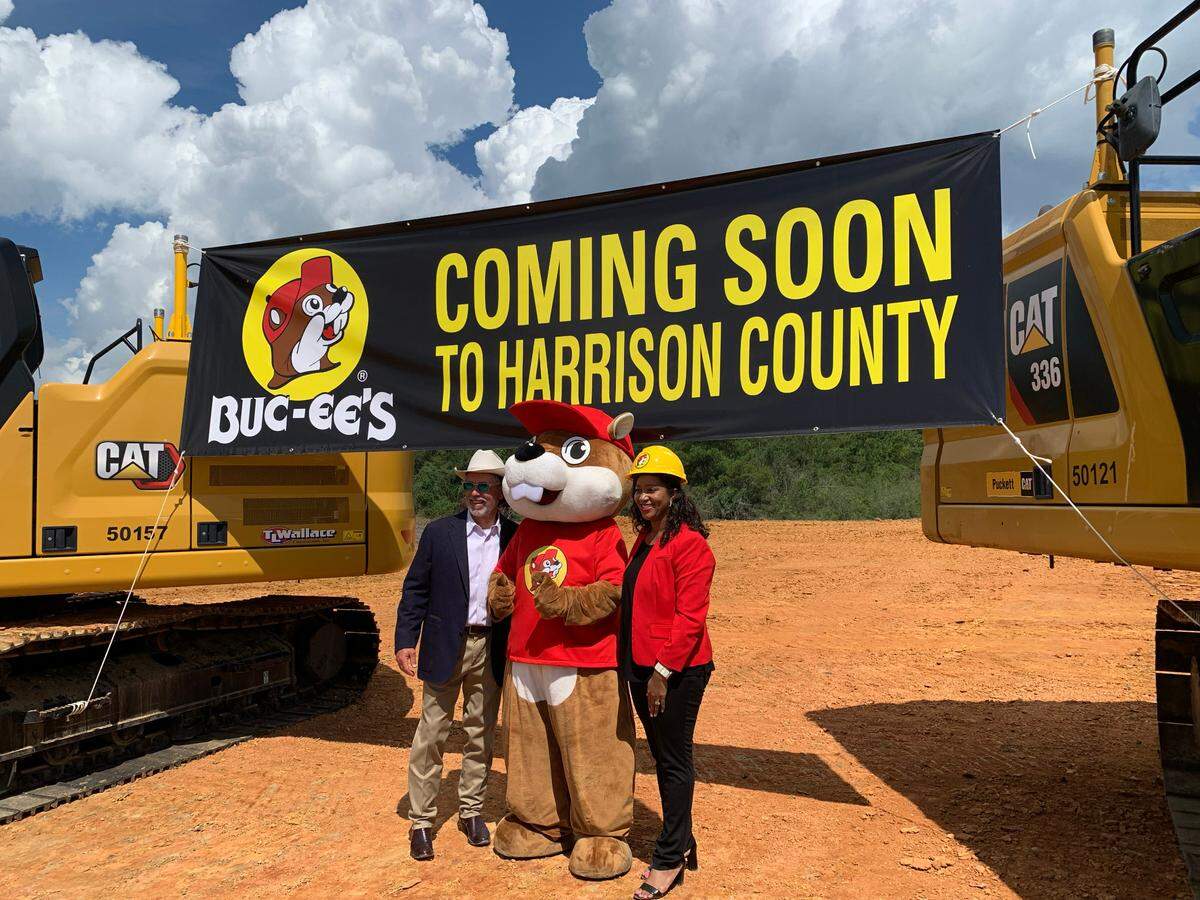 Buc-ee’s founded and owner Arch “Beaver” Aplin and Brandi Hough, with the Harrison County Development Authority, pose with the Buc-ee’s mascot at the ground breaking for the future Harrison County Buc-ee’s location off I-10 in Harrison County on Tuesday, Sept. 12, 2023.