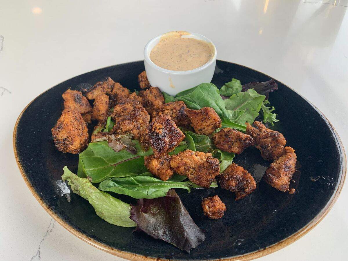 The blackened alligator at Coterie Restaurant and Oyster Bar.