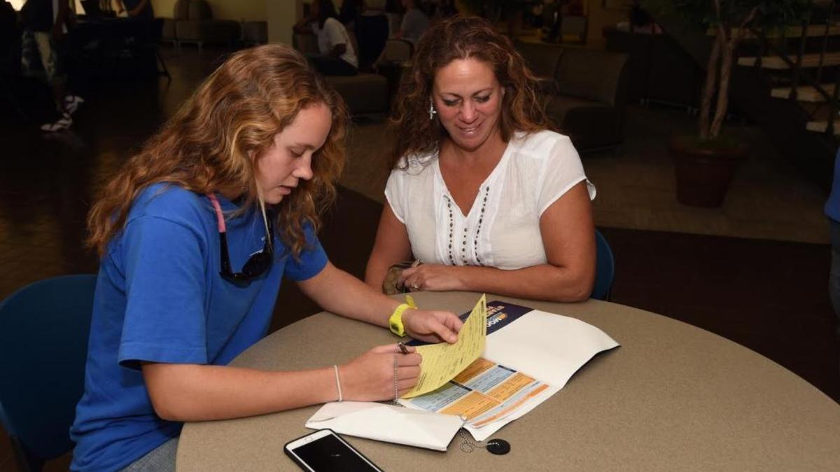 Jess Woods of Vancleave and her mother, Kathleen, fill out financial-aid paperword at Mississippi Gulf Coast Community College’s Jackson County campus.