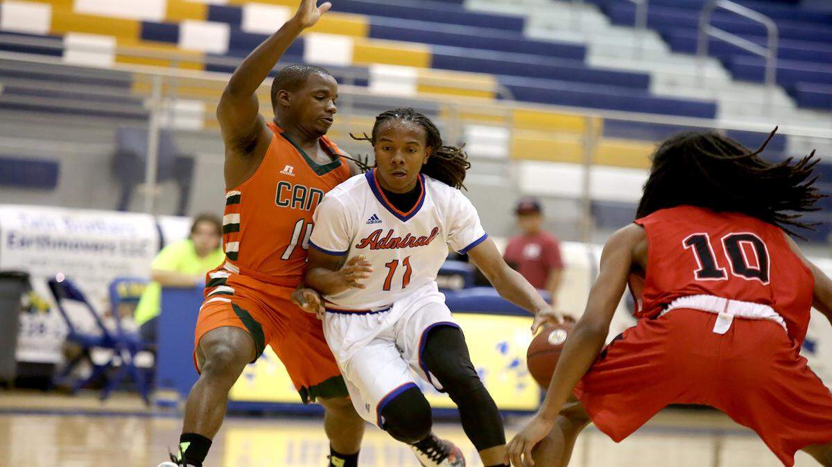 AMANDA McCOY/SUN HERALD 
 Gulfport's Tyrell McArthur dribbles the ball while guarded by West Harrison's DeAnthony Bowie during the South Mississippi All-Starr Showcase on Thursday, May 26, 2016, at St. Martin High.