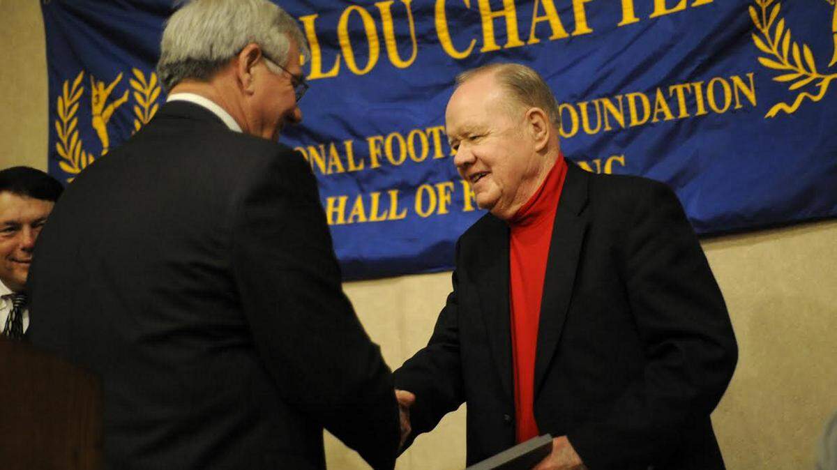 COURTESY NATCHEZ DEMOCRATLongtime high school football coach Ed Reed receives the Contributions to Amateur Football award from the National Football Foundation and College Hall of Fame Miss-Lou Chapter in November 2013 at the Eola Hotel in Natchez.