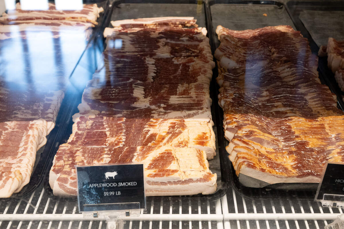 Cuts of bacon are on display at Johnny Pizmo’s Butchery and Marketplace in Gulfport.