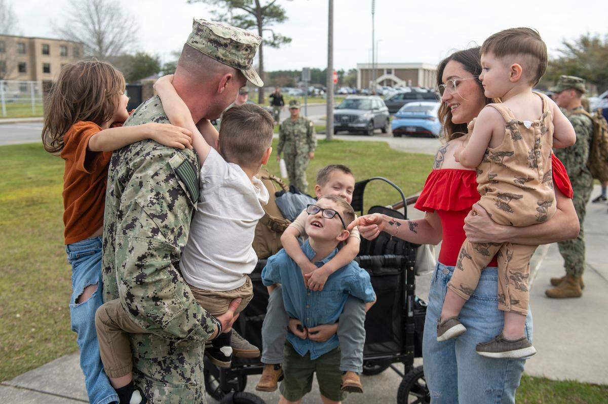 Families welcome members of Naval Mobile Construction Battalion 1 as they return home from deployment on Thursday, March 13, 2025, to Naval Construction Battalion Center Gulfport.