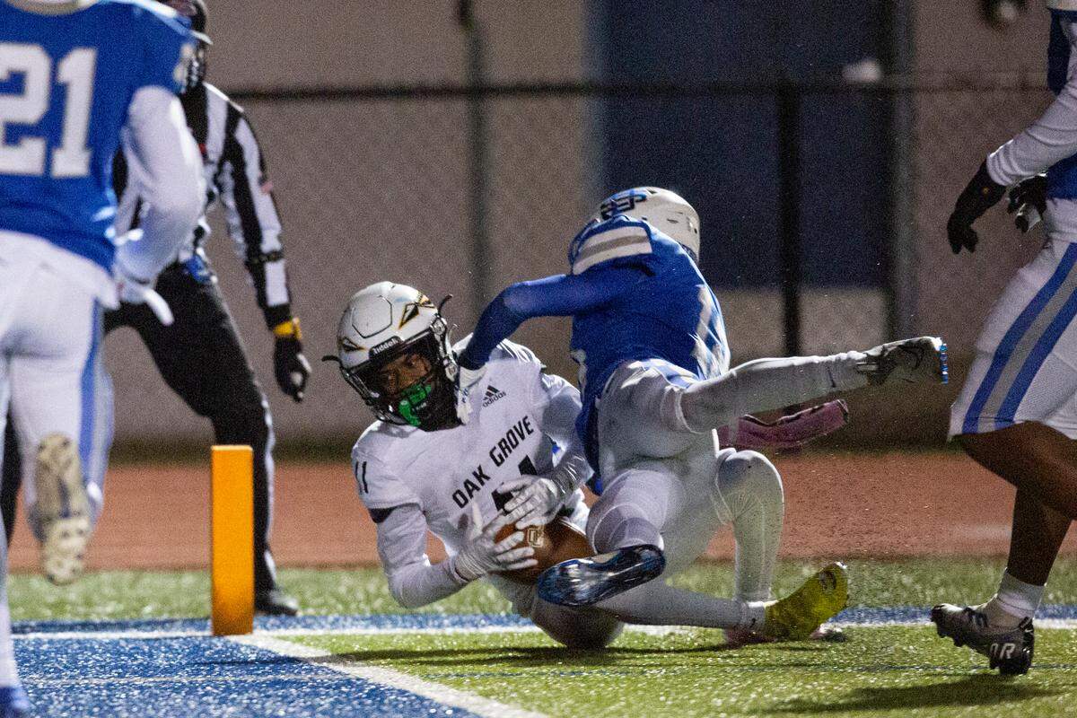 Oak Grove’s PJ Woodland scores a touchdown during a 6A playoff game at Greyhound Stadium in Ocean Springs on Friday, Nov. 18, 2022.