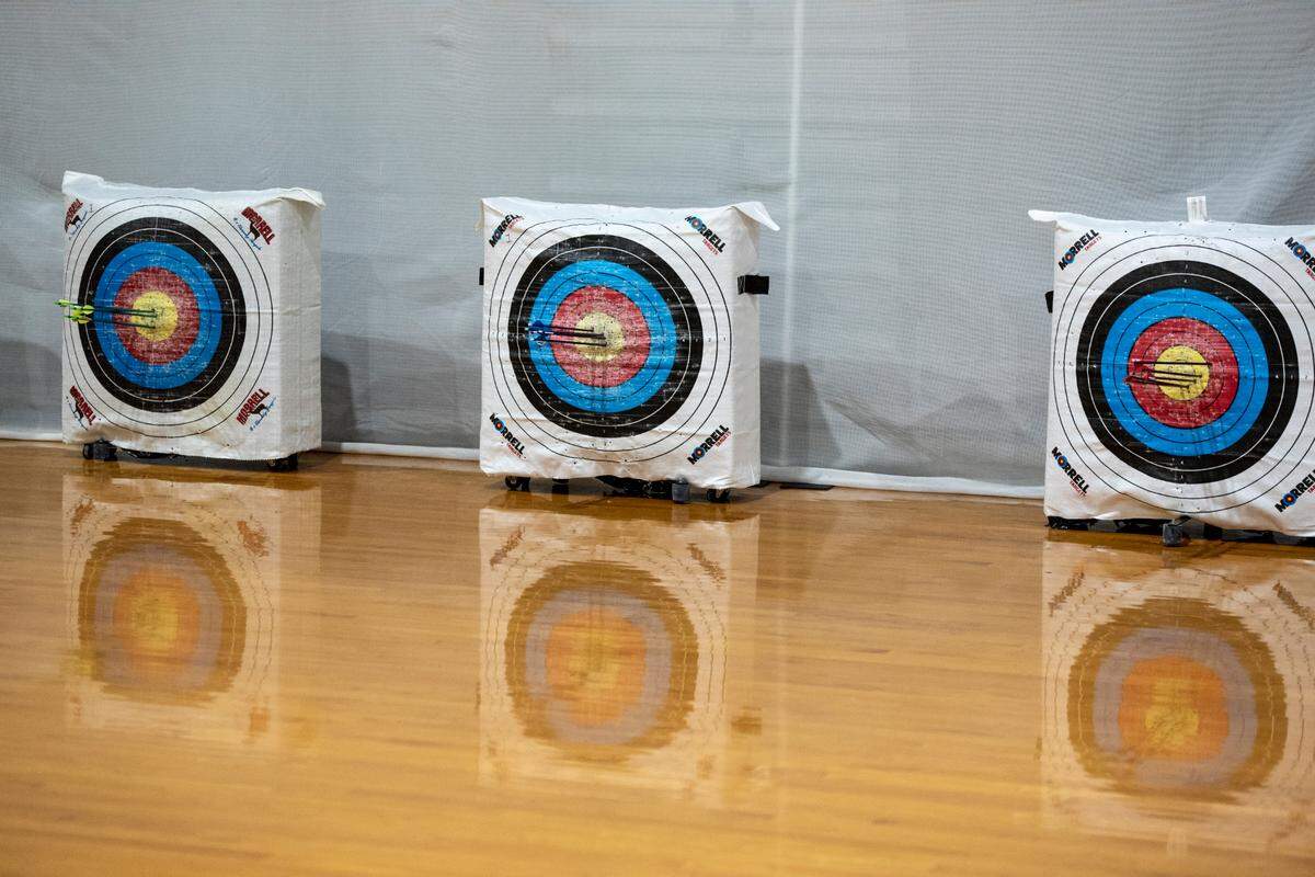 Arrows from D’Iberville High School archery team members Avary Peterson, right, Michael Kinney, center, and Landon Garrett, left, hit their mark during a practice at D’Iberville High School on Thursday, April 18, 2024.