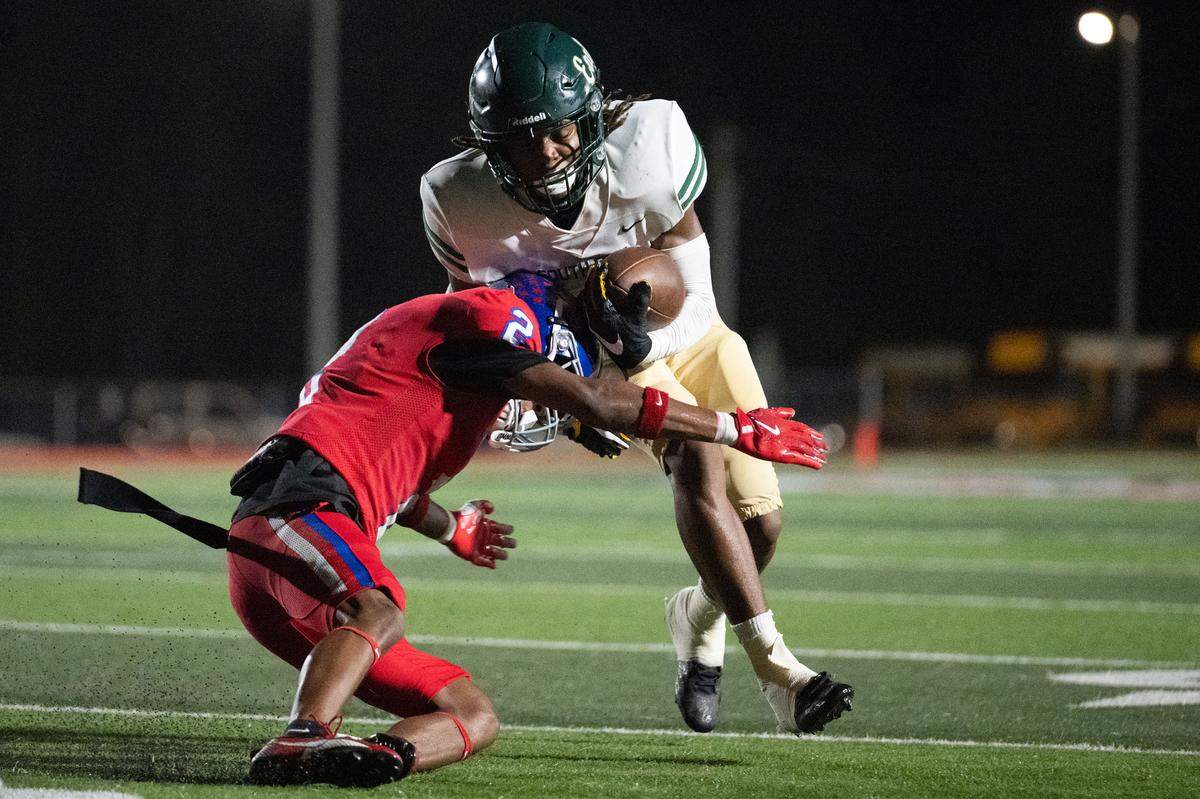 Pass Christian defensive back Amarie James (2) tackles South Pike wide receiver Antwaun Adams (4).