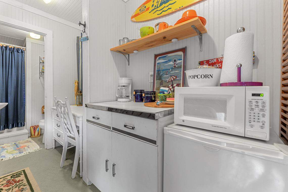 The downstairs apartment at Breezy Porches in Waveland includes an open kitchenette next to the living room.