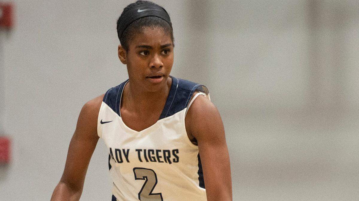 Moss Point’s Ar’yonna Miller dribbles the ball down the court during a game against Biloxi at Moss Point High School in Moss Point on Tuesday, Dec. 21, 2021.