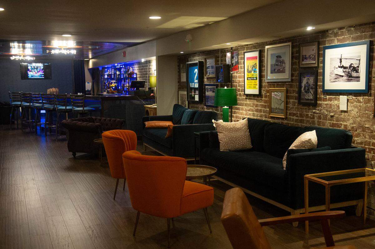 Couches and chairs decorate Ground Zero’s new lounge and bar space, The Back Door, on the second floor of their Biloxi location on Wednesday, May 21, 2025.