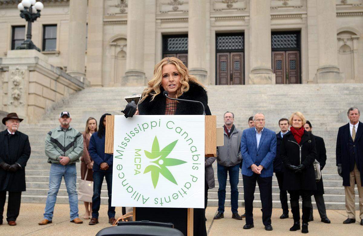 From the south steps of the Capital, Mississippi Cannabis Patients Alliance founder Angie Calhoun with supporters, makes a plea to the governor to change his position on medical marijuana, Tuesday, Jan. 4, 2021 in Jackson. He signed the bill on Feb. 2, 2022.