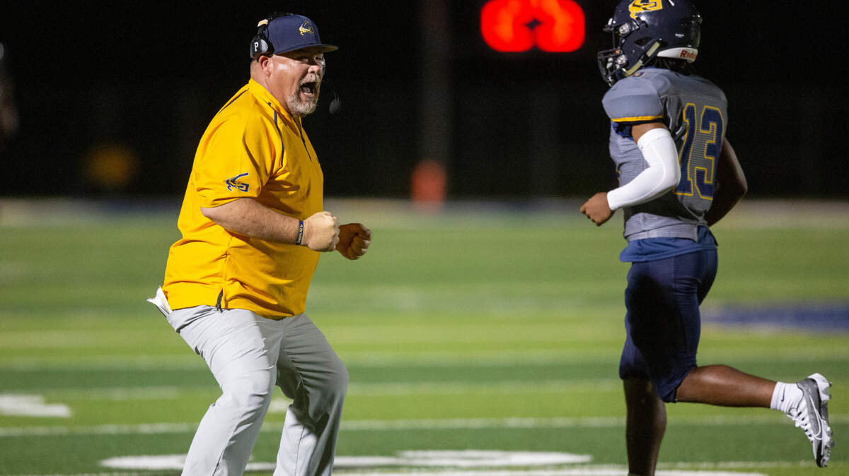 Gautier Head Coach Marc High celebrates as his players score a touchdown against Pascagoula at Gautier High School in Gautier on Friday, Sept. 2, 2022.