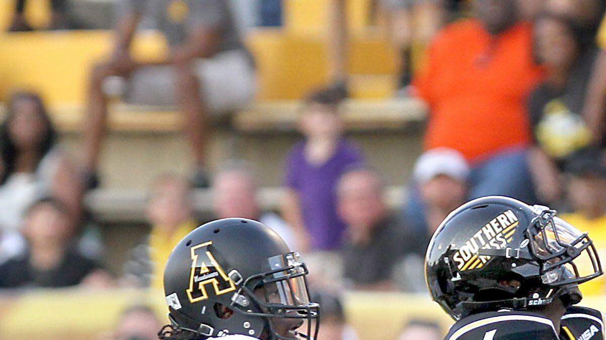 TIM ISBELL/SUN HERALD
Southern Miss receiver Marquise Ricard lays out for a pass as Dante Blackmon of Appalachian State defends in 2014 in Hattiesburg. Ricard is back from injury after missing all of last season.
