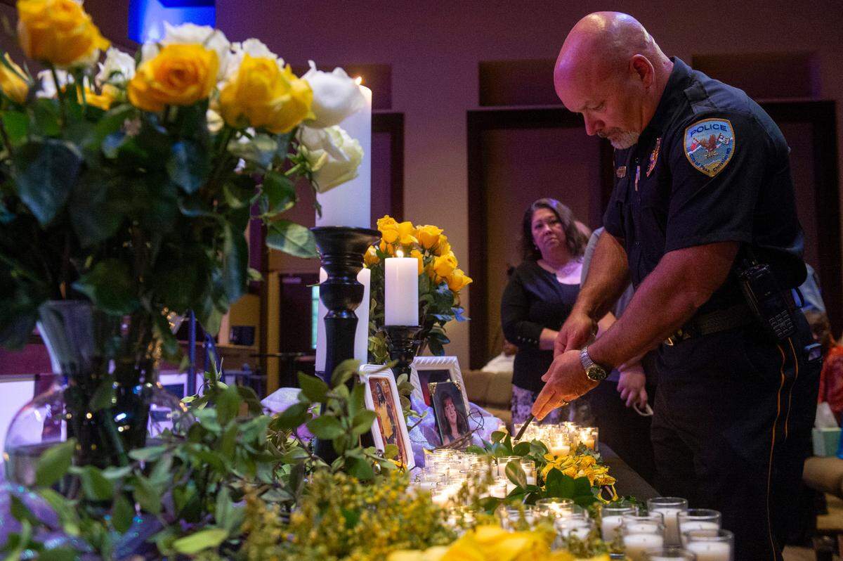 Law enforcement officers light candles in front of portraits of crime victims during a coast-wide candlelight ceremony as a part of National Crime Victims’ Rights Week at First Baptist Church of Gulfport on Tuesday, April 29, 2025.