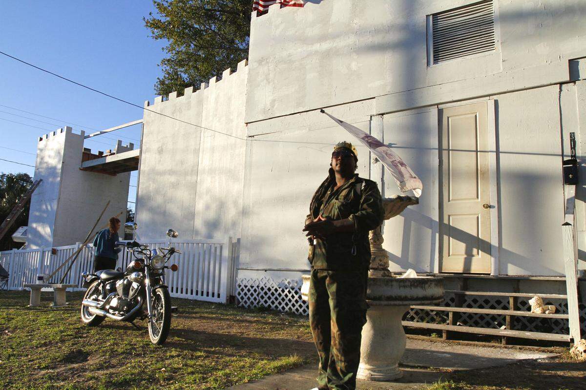 A Gulfport man who legally changed his name to Father Jesus stands before the castle facade added to the front of his house to glorify God, he says. He secured the permitting from the city needed to build the structure and has had it inspected multiple times.