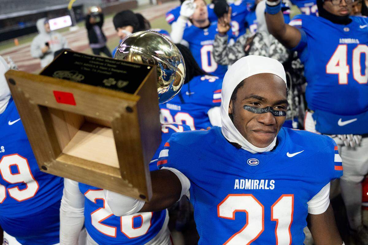 Gulfport wide receiver Mylan Stubbs (21) gets his hands on the championship trophy Saturday after getting his hands on a Hail Mary pass on the final play of the game.