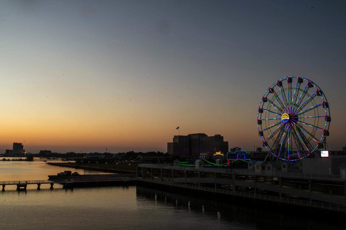 The Ferris wheel at Margaritaville’s new Paradise Pier adds some light to the Biloxi skyline on Thursday, Oct. 13, 2022.