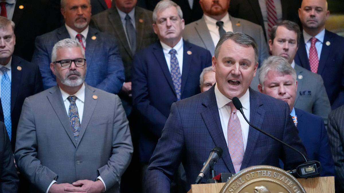 Flanked by legislators, Mississippi Speaker of the House of Representatives Rep. Jason White, R-West, at the podium, speaks at a news conference about the body voting Wednesday to set a new formula to calculate how much money the state will spend on public schools.