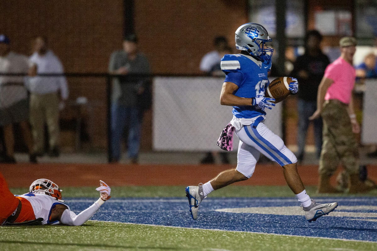 Ocean Springs’ Will Gray scores a touchdown during a game at Greyhound Stadium in Ocean Springs on Friday, Oct. 28, 2022.