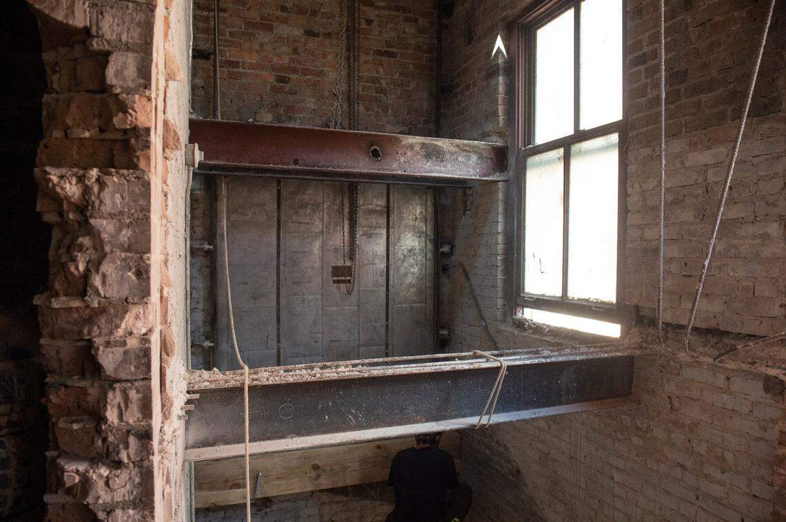 A exposed fire door will remain in the Barq Building, which is being restored as a mixed-use development that is part of The District on Howard, in downtown Biloxi on Monday, Sept. 19, 2022.