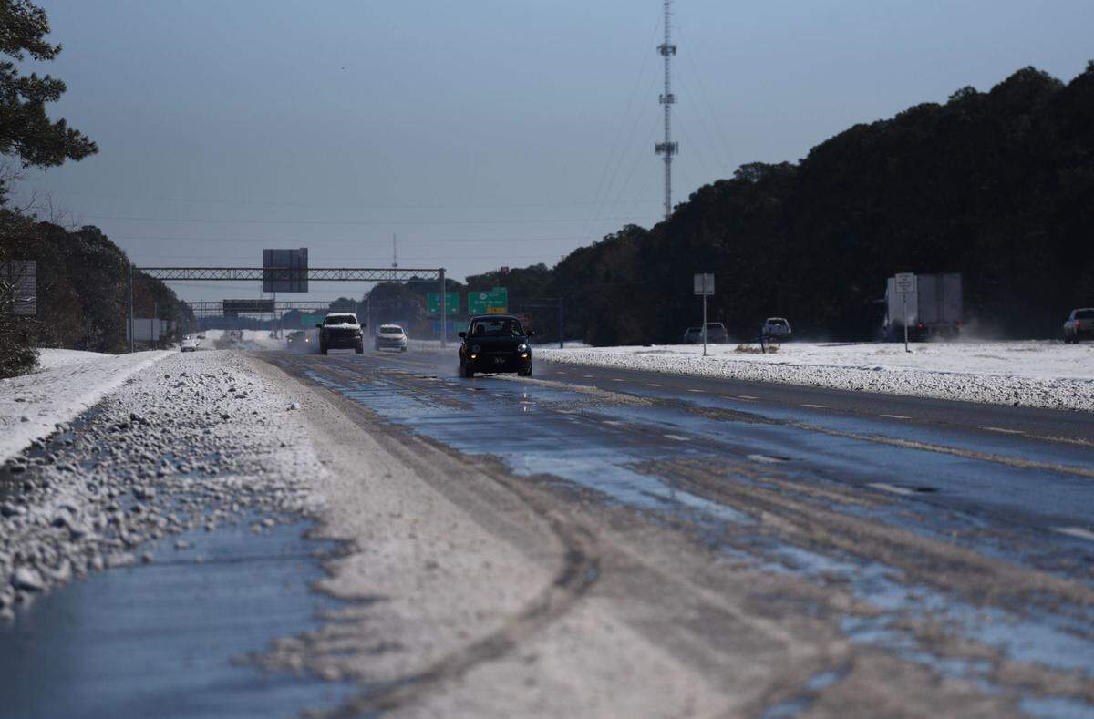 Interstate 10 in South Mississippi is treacherous, but passable, Wednesday, Jan. 22, 2025, a day after a rare snowstorm blanketed the region.