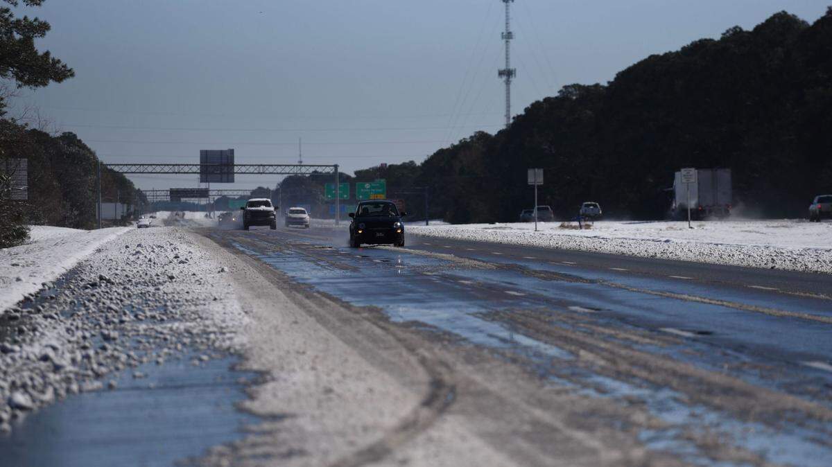Interstate 10 in South Mississippi is treacherous, but passable, Wednesday, Jan. 22, 2025, a day after a rare snowstorm blanketed the region.