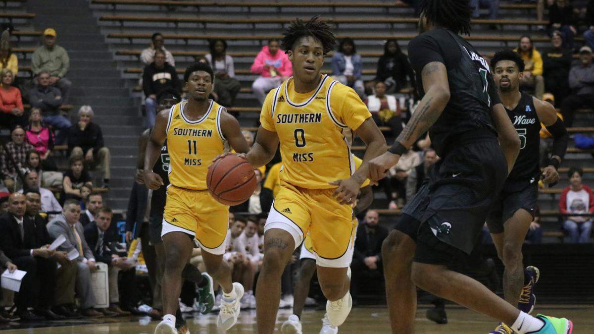 Southern Miss sophomore guard Gabe Watson (0) as junior guard LaDavius Draine (11) trails on Wednesday against Tulane at Reed Green Coliseum in Hattiesburg on Dec. 4, 2019.