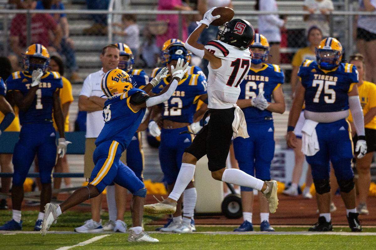 St. Stanislaus’ Levi Green catches a pass from quarterback Ian Gael Gonzalez Rioz during a game at Bay High in Bay St. Louis on Friday, Sept. 1, 2023.