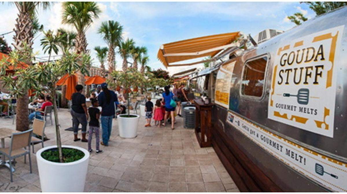 HARBOR POINT PROPOSAL 
 The Gulf Coast Restaurant Group, which has eight Half Shell Oyster House restaurants, including the original downtown Gulfport location, submitted the winning proposal for a Gulfport harbor restaurant. The ground floor includes this beach patio with food vending, outdoor seating and other amenities around an elevated building.
