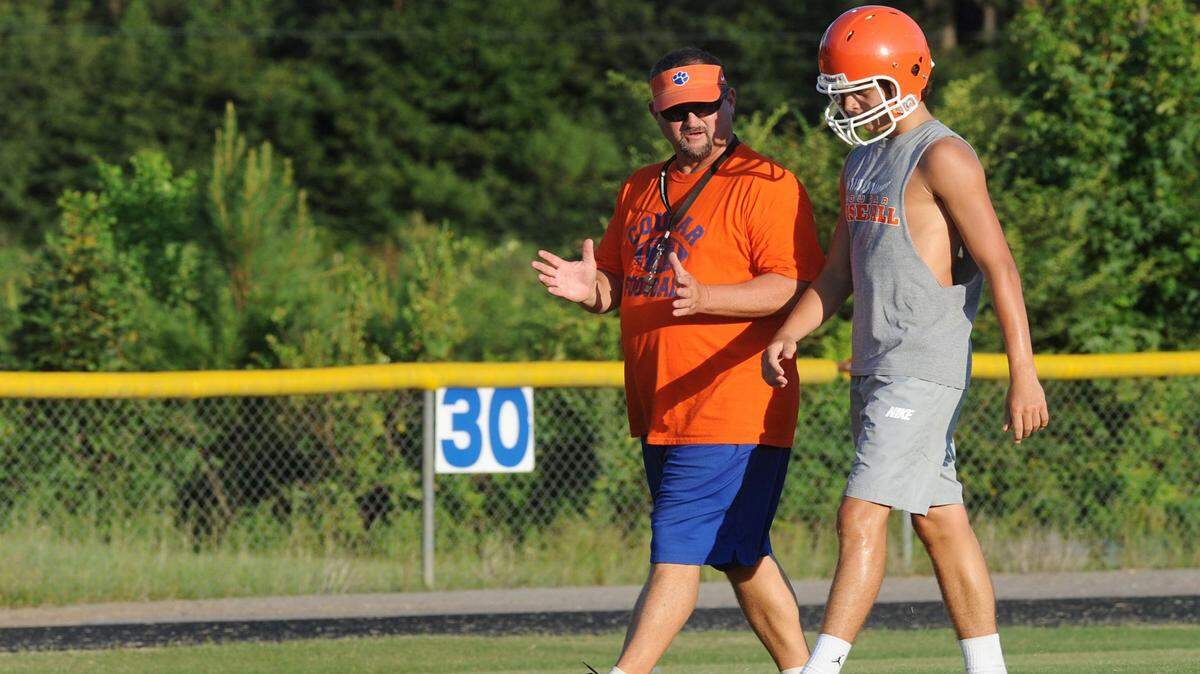 HATTIESBURG AMERICAN 
 Former Forrest County AHS and Columbia Academy coach Larry Dolan, left, has been hired to lead Pearl River Central's football program.