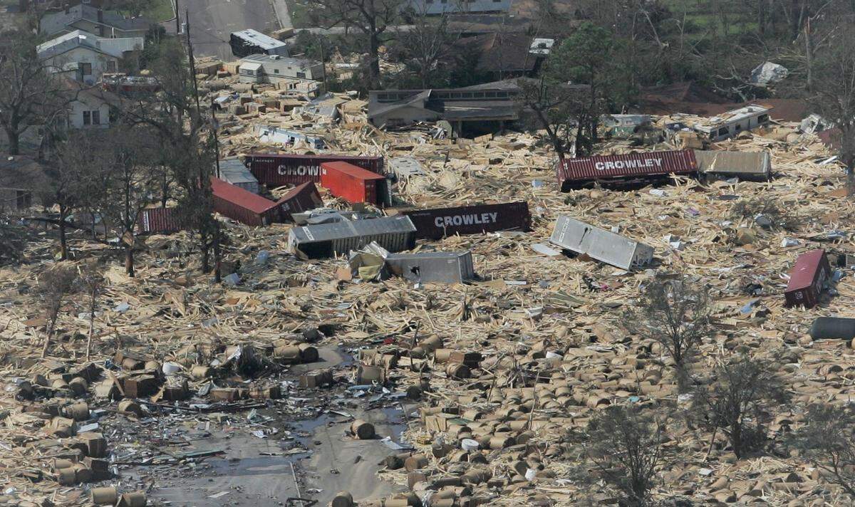 Shipping containers and their contents from the State Port at Gulfport are strewn across the area of Broad Ave. at U. S. 90 in Gulfport, Miss., on August 30, 2005, the morning after Hurricane Katrina struck the Mississippi Gulf Coast.